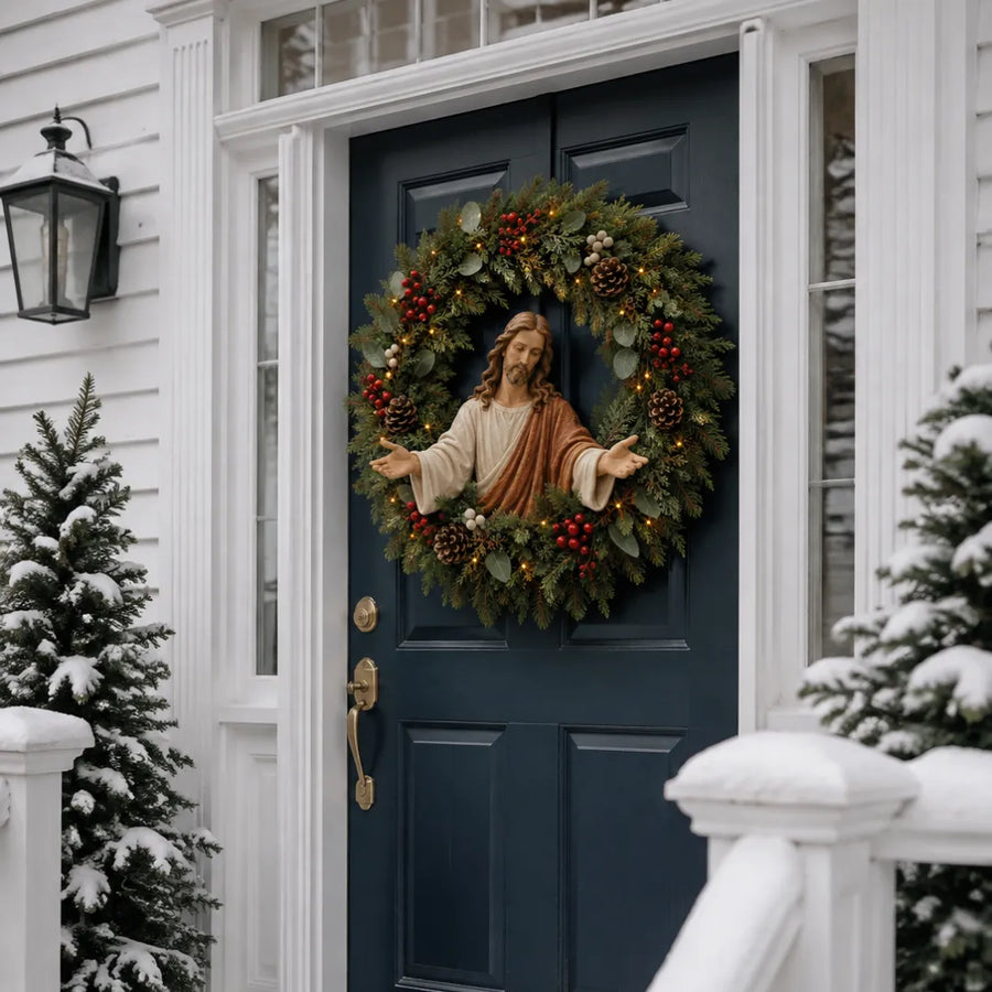 Lighted Jesus wreath on a red front door in winter